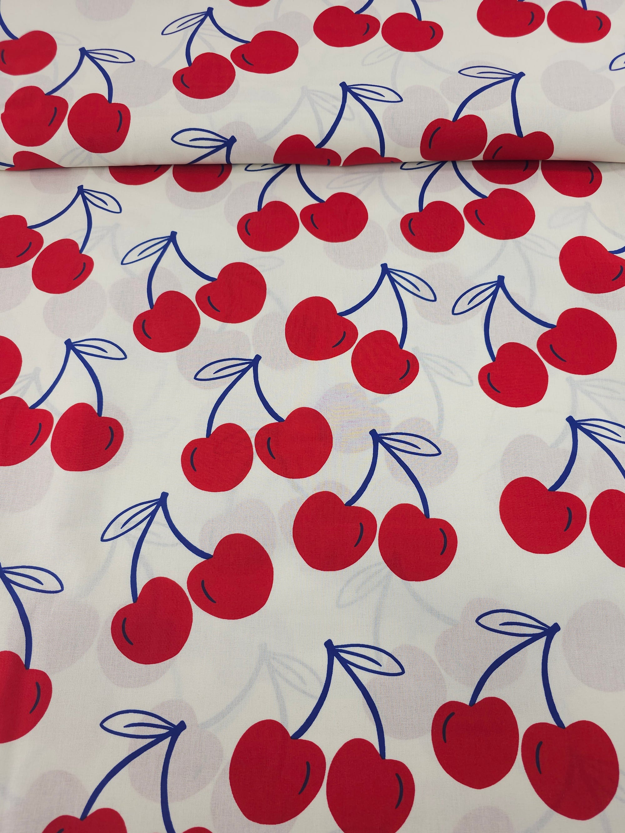 Ivory/Red Large Cherries Coated Cotton 60"