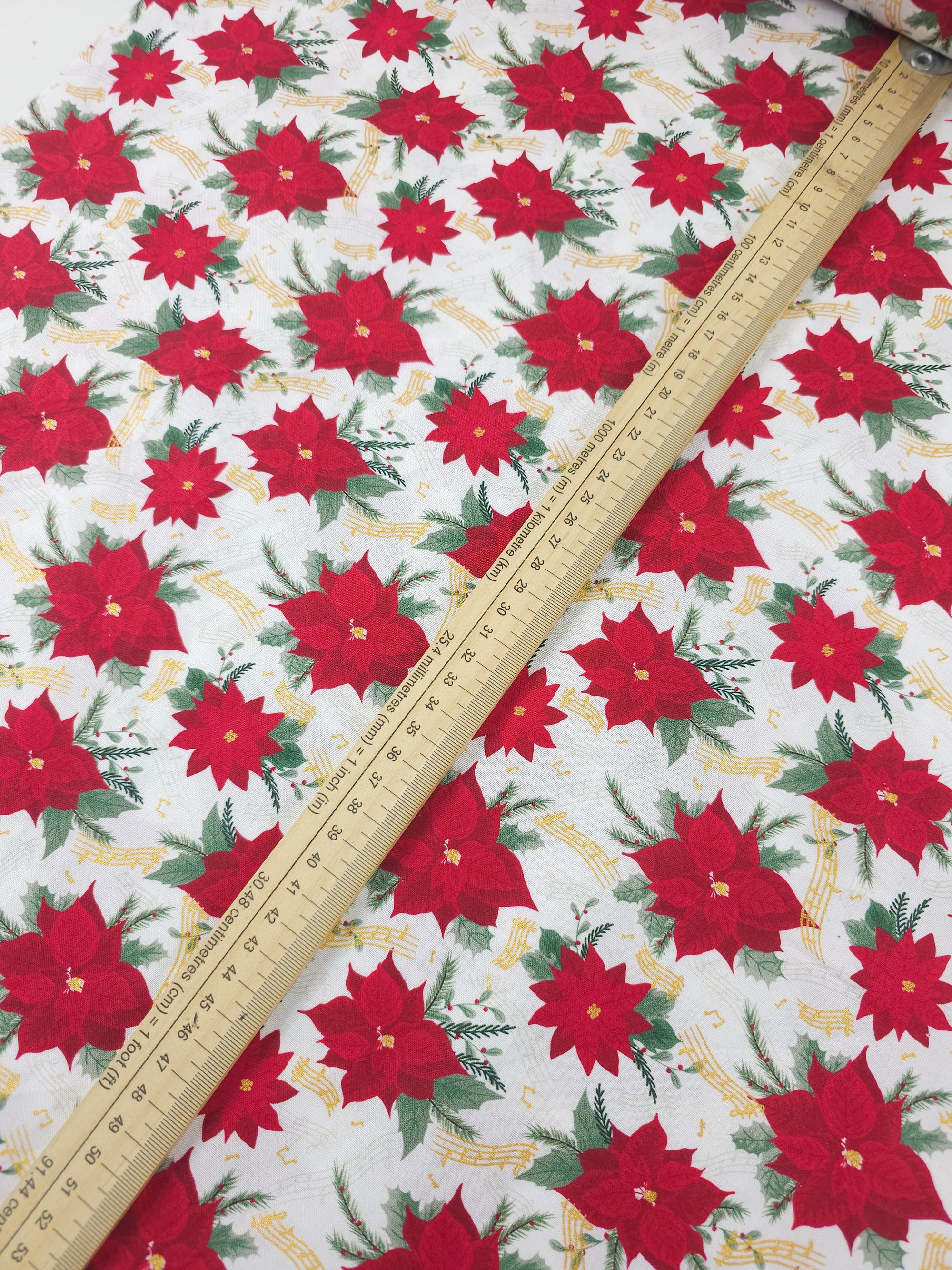 Red/White Musical Poinsettia Floral 100% Cotton