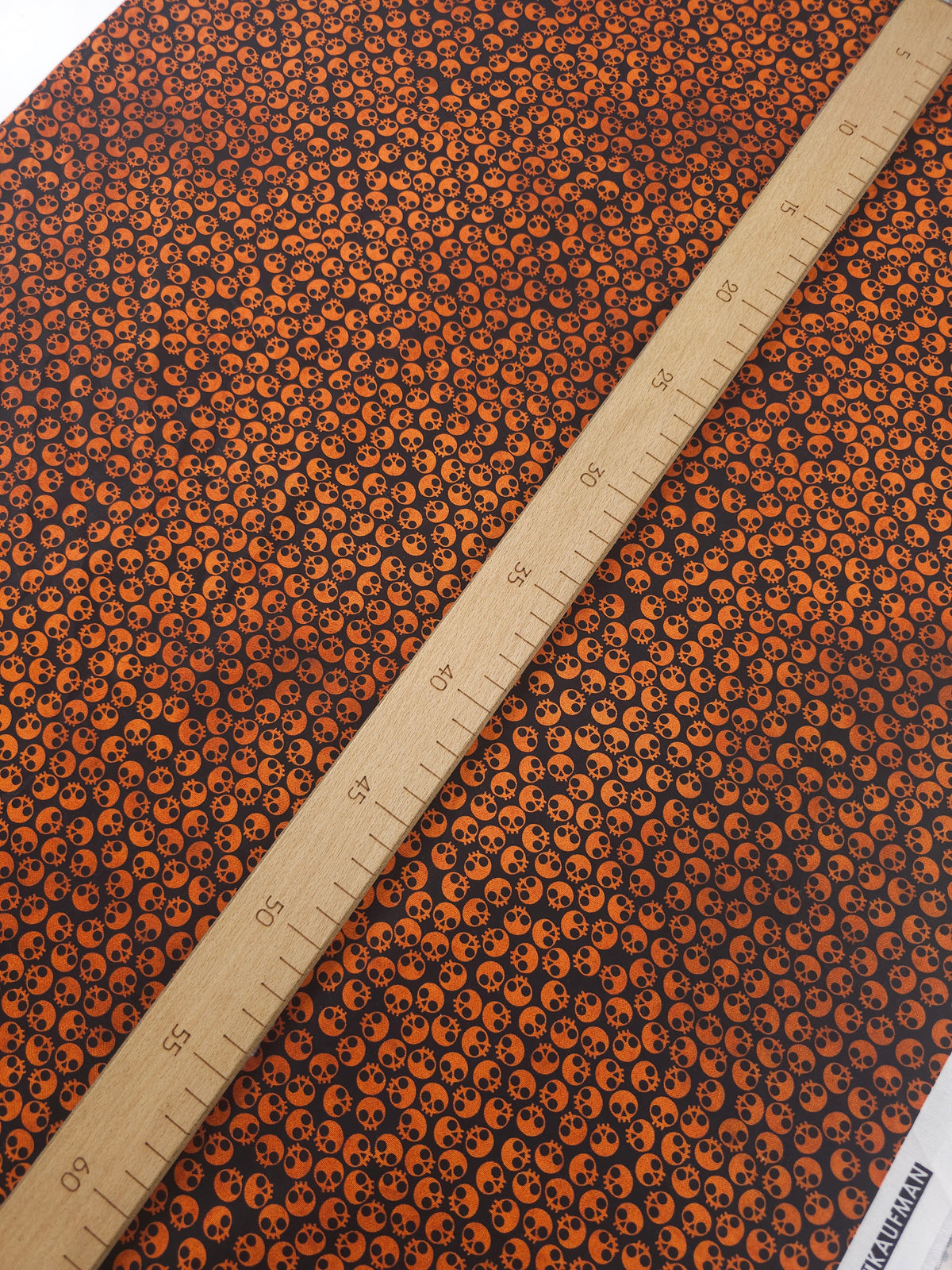 Orange/Black Tossed Skull Heads 100% Cotton - Robert Kaufman