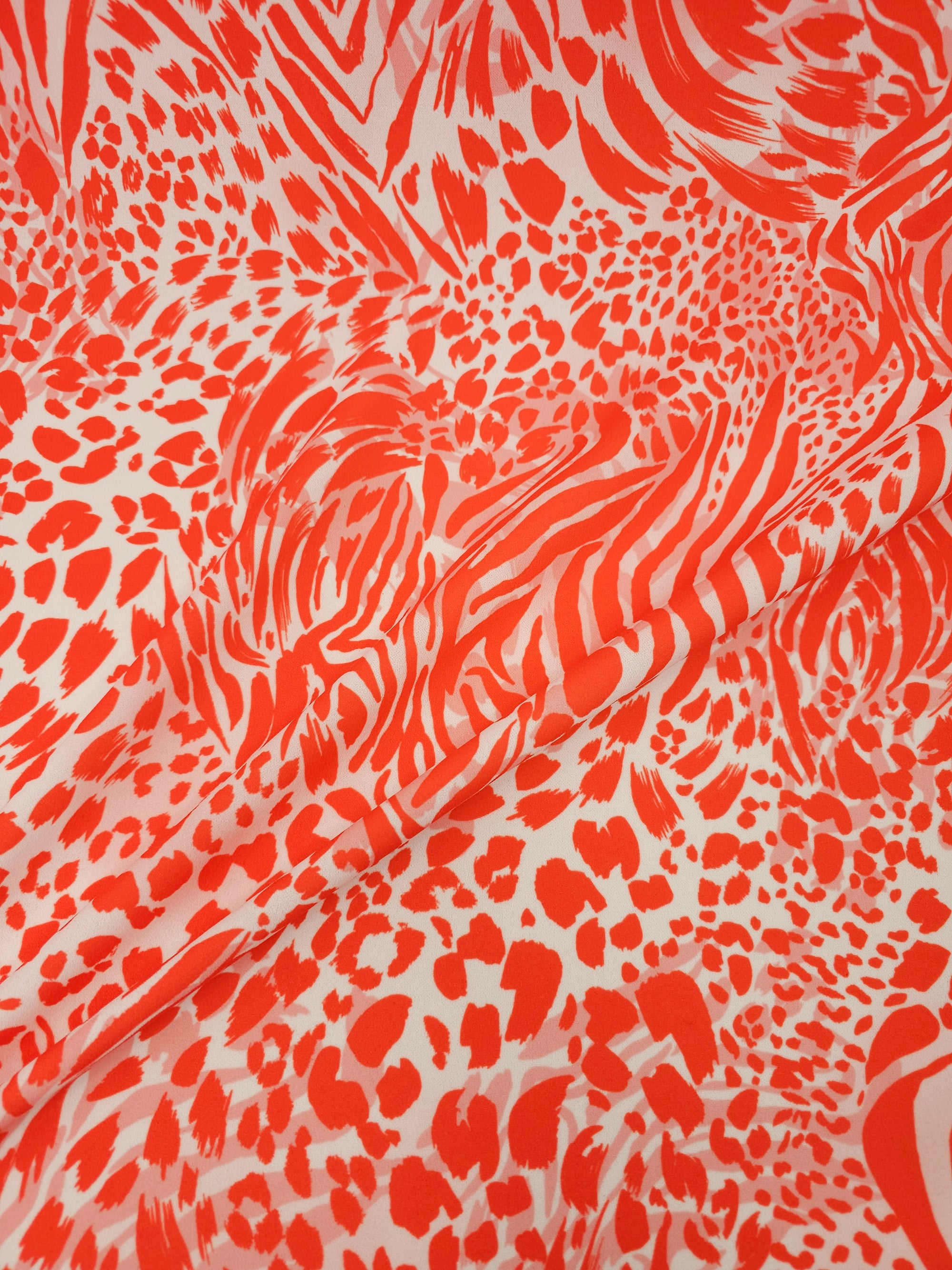 Orangey Red/White Animal Print Poly Jersey