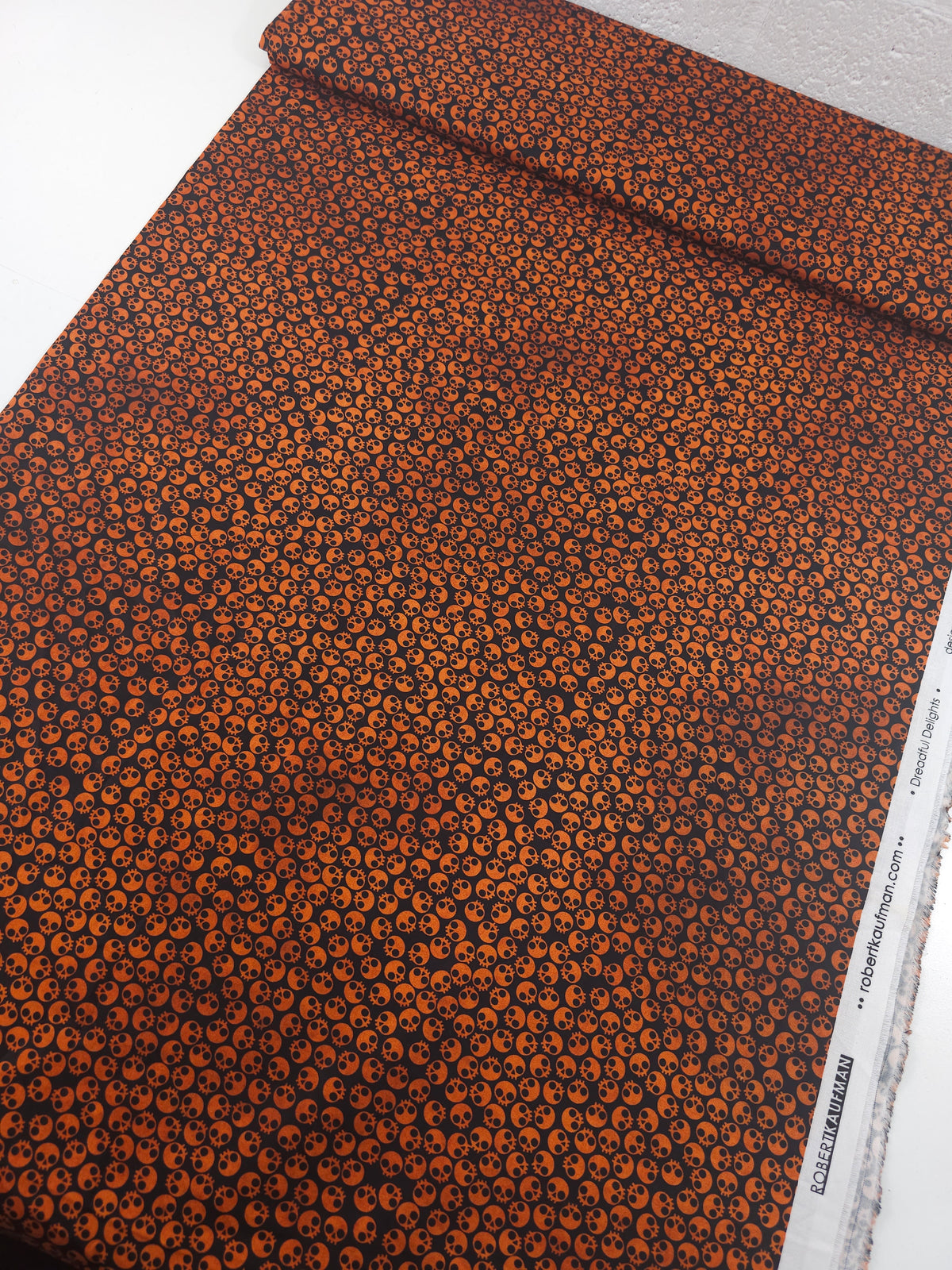 Orange/Black Tossed Skull Heads 100% Cotton - Robert Kaufman
